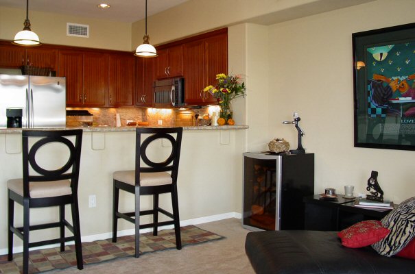 Custom Kitchen has Granite Counters, Stainless Steel Appliances, Bar Seating.