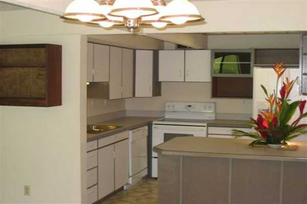 TAKE LIFE EASY! No lawn care here - just plenty of swimming. Tennis and golf close by, too! Beat the rent race and invest in a beautiful townhome. Bedrooms on 2nd story. Roomy ground floor has comfortably-sized kitchen. Enjoy your own private lanai.